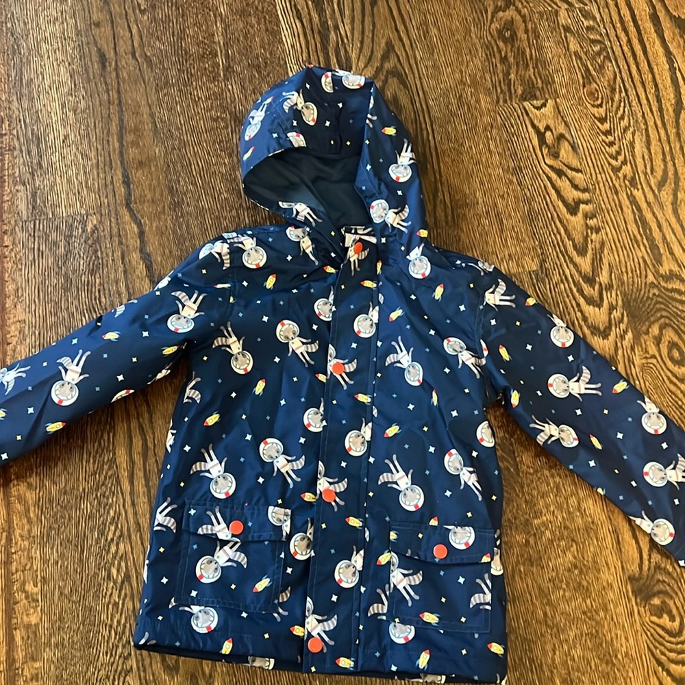 Cartwheels lined raincoat. Gently used.